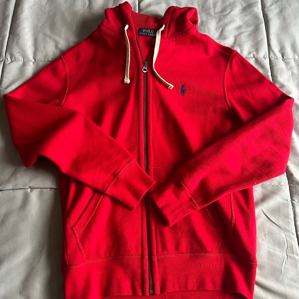 This is a polo fleece full zip hoodie. It’s red and a size small.